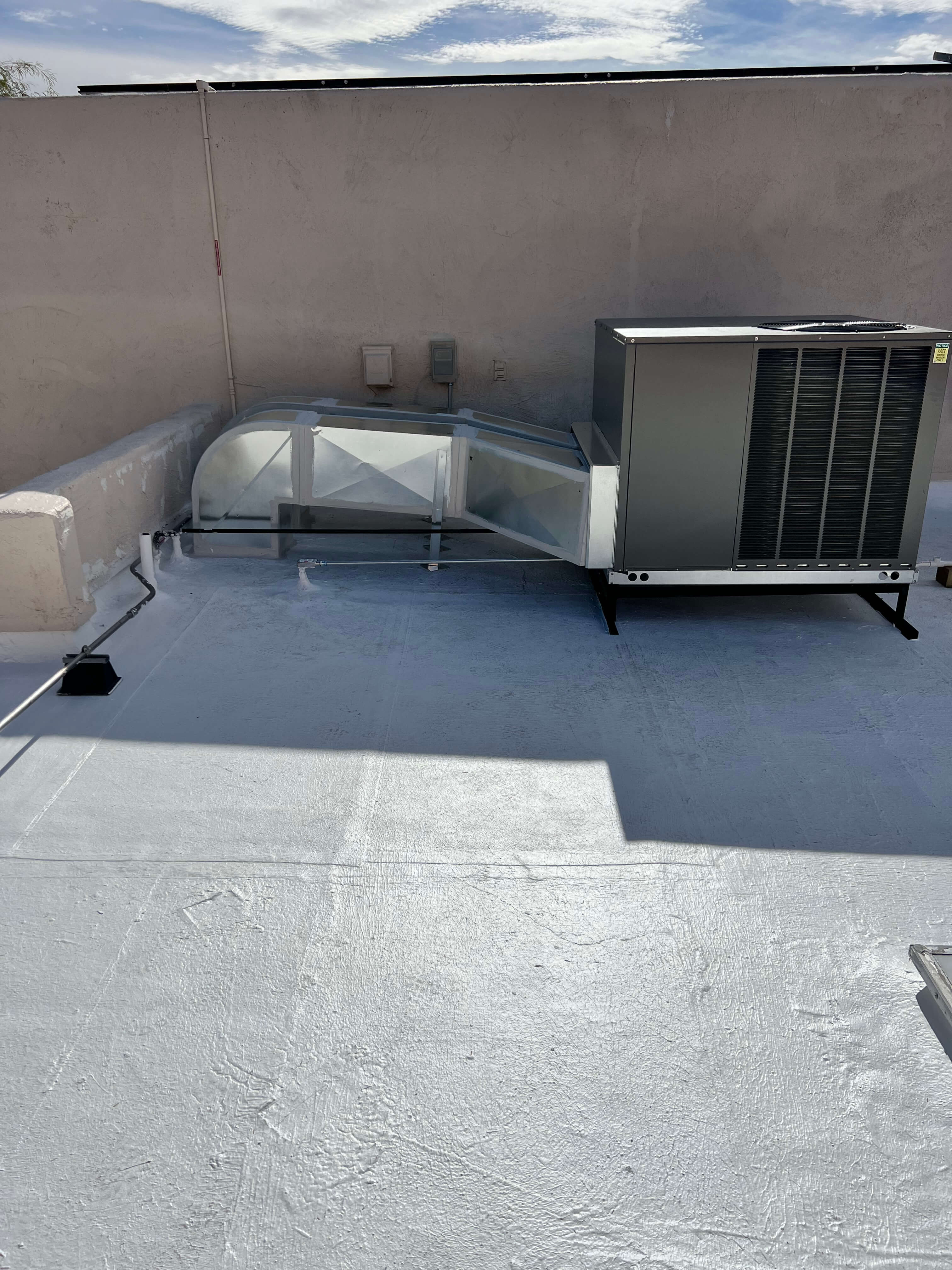 Portfolio image of SEER HVAC work done on the roof of a local business, servicing their AC unit during the hot summer located in Oro Valley, Arizona.